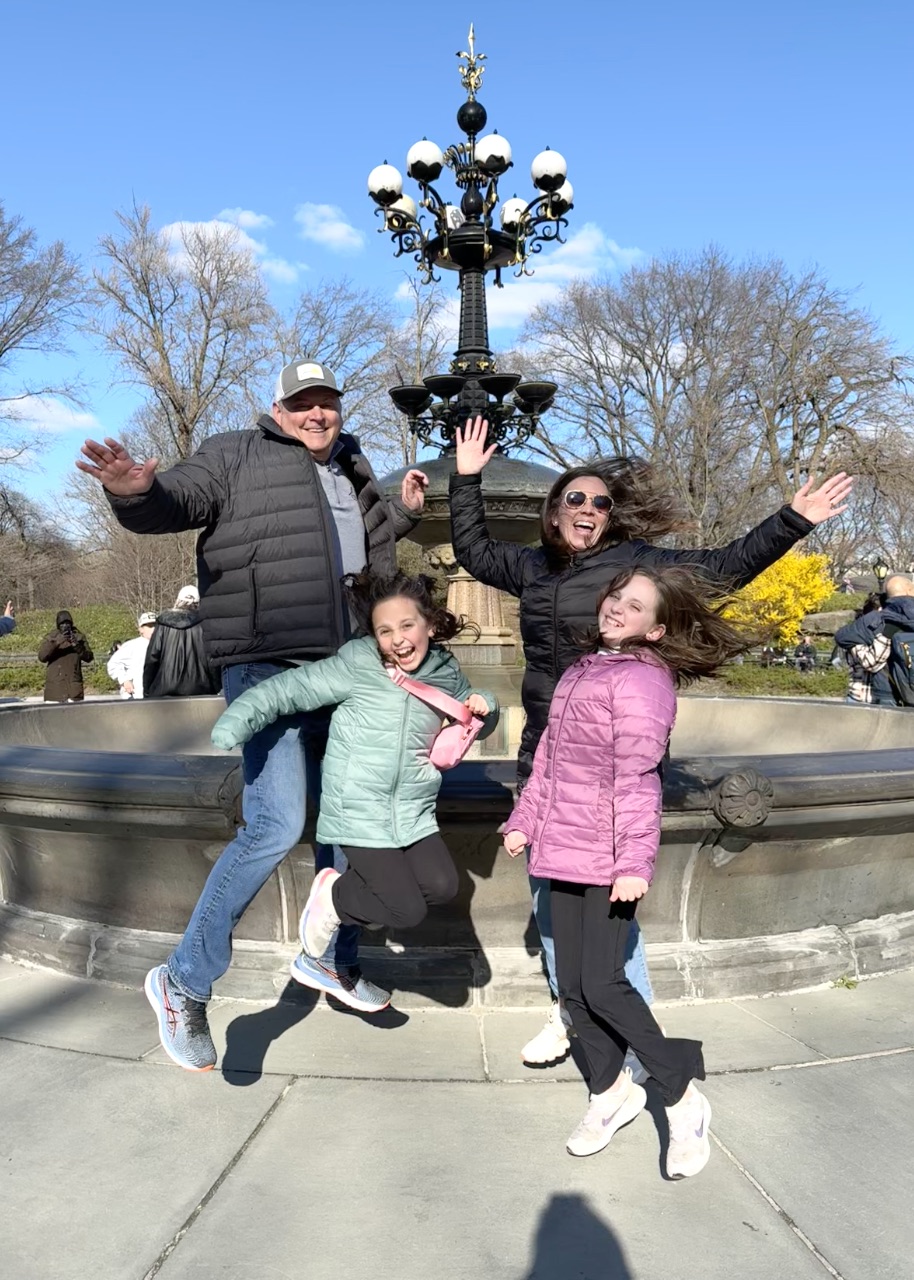 Family enjoying a Central Park pedicab tour at Cherry Hill